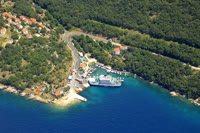 Porozina is a charming coastal town on the island of Cres, known for its crystal-clear waters and stunning beaches.