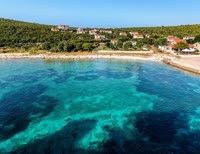 Maslinica is a charming fishing village nestled on the island of Solta, offering stunning views of the Adriatic Sea.