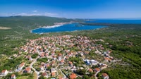 Kornic is a picturesque coastal town on the island of Krk, known for its stunning views of the Adriatic Sea.