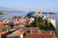Mundanije, a charming village located on the picturesque island of Rab, offers stunning views of the surrounding Adriatic Sea and lush green landscapes.