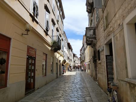 Eufrazijeva Street in Porec is a charming, historic street lined with colorful buildings, shops, and cafes, offering a delightful stroll through the town's vibrant center.