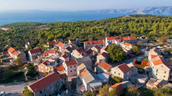 Brusje is a charming village located on the island of Hvar in Croatia, surrounded by lush greenery and olive groves.