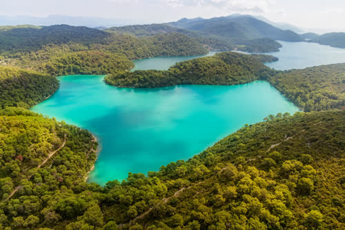 Explore the stunning beauty of National Park Mljet in Croatia, with its lush greenery, crystal-clear lakes, and ancient ruins. Discover the perfect escape into nature's paradise.