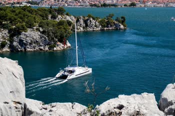 Enjoy a scenic stroll along the picturesque St. Anthony canal near Sibenik, Croatia. Immerse yourself in nature and admire the charming boats and historic architecture.